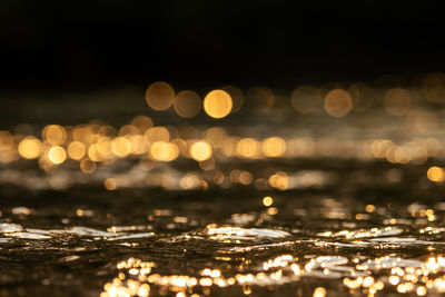 Bokeh from sunlight that hits the water surface