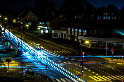 High angle view of light trails on road at night