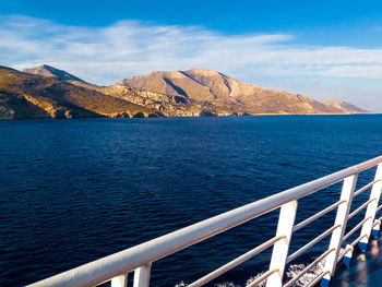 Scenic view of sea and mountains against sky