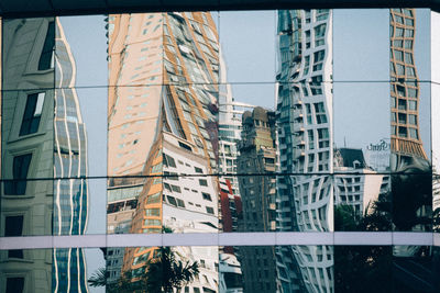 Reflection of buildings on glass window