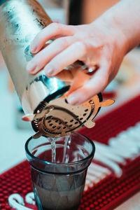 Cocktail being prepared with gin