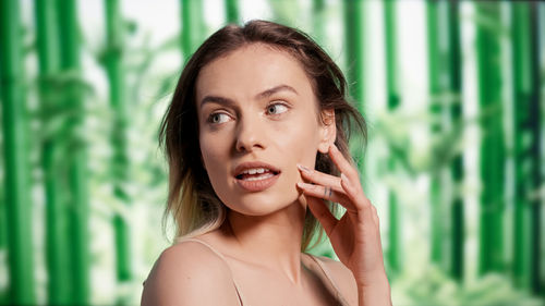 Portrait of young woman looking away