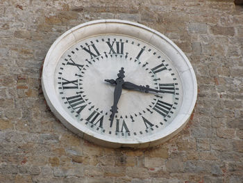 Clock on stone wall