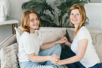 Mom and daughter with red hair. red-haired women with fair skin with freckles.