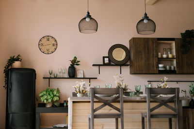 Interior design of the kitchen-dining room in a modern scandinavian style with a wooden bar table 