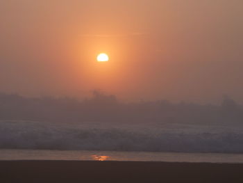 Scenic view of sunset over sea