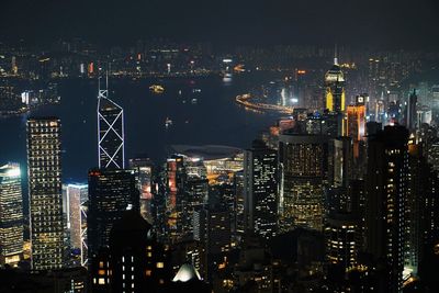 High angle view of illuminated buildings in city at night