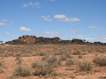 Scenic view of arid landscape against sky