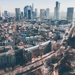 High angle view of buildings in city against sky