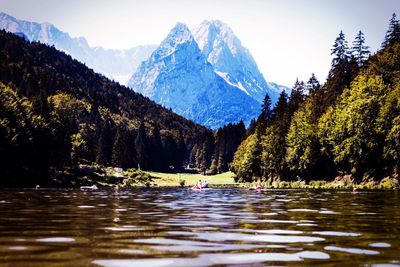 Scenic view of lake with mountains in background