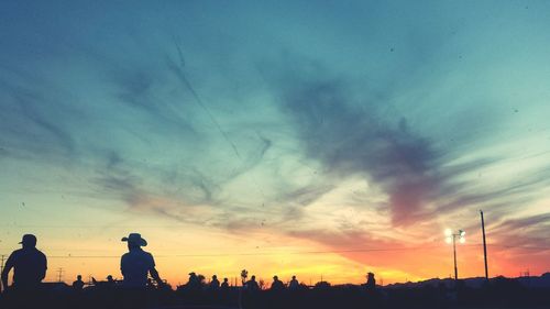 Low angle view of silhouette trees against sky at sunset