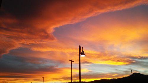 Low angle view of dramatic sky during sunset