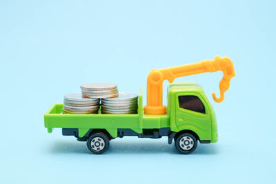 Toy car against blue background