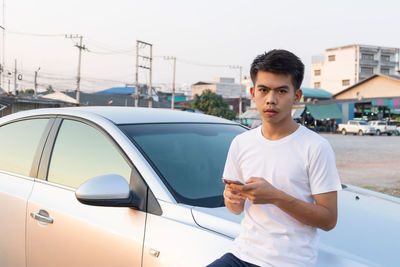 Portrait of young man using mobile phone