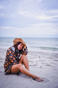 Woman sitting on beach