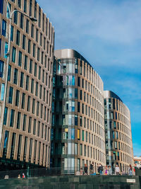 Low angle view of modern buildings against sky