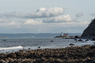 Seascape with lighthouse in the distance