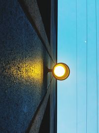 Low angle view of illuminated lamp