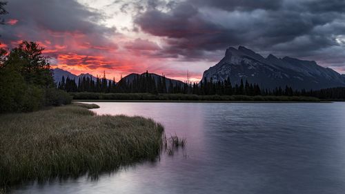 Scenic view of lake against sky during sunset