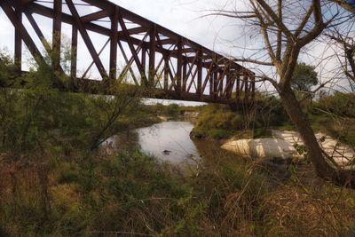 Bridge over river against sky