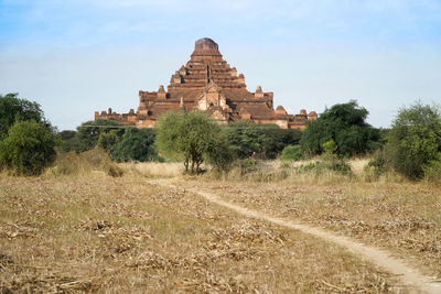 Low angle view of famous temple in bagan on dry agricultural field