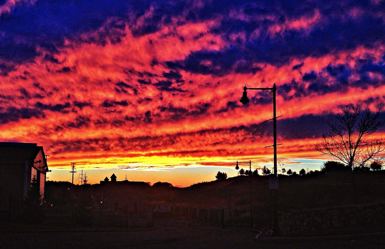 sunset, silhouette, sky, orange color, cloud - sky, scenics, beauty in nature, dramatic sky, tranquil scene, tranquility, landscape, cloud, nature, idyllic, cloudy, moody sky, atmospheric mood, transportation, outdoors, majestic