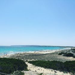 Scenic view of beach against cloudy sky