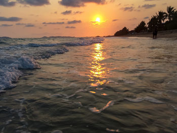 Scenic view of sea against sky during sunset