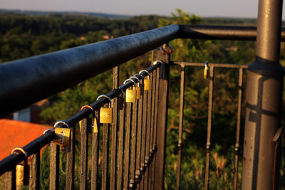 Close-up of railing against fence