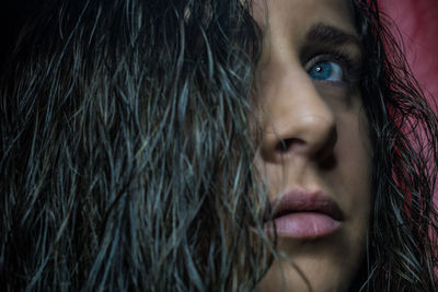 Close-up of young woman looking away