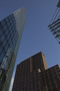 Low angle view of skyscraper against clear sky