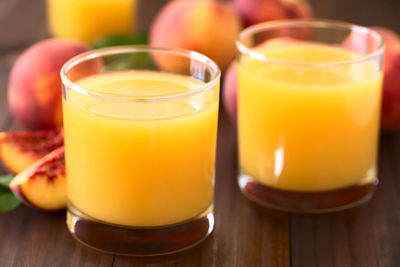 Close-up of orange juice on table