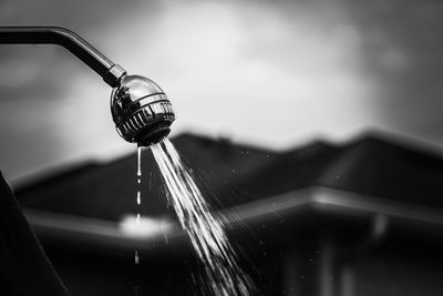 Low angle view of water splashing against sky