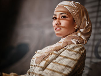 Portrait of young woman looking away