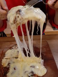 Close-up of hand holding ice cream