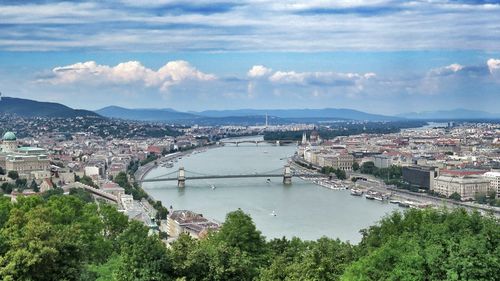 Aerial view of river with cityscape in background