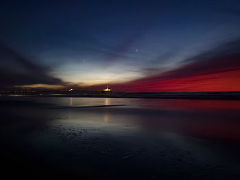 Scenic view of sea against sky at night
