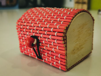 Close-up of red container on table