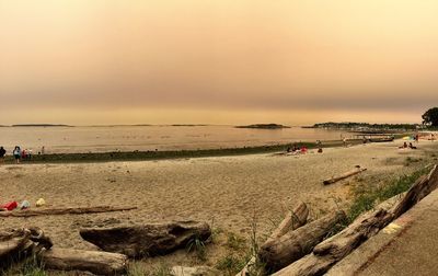 Scenic view of beach against sky during sunset