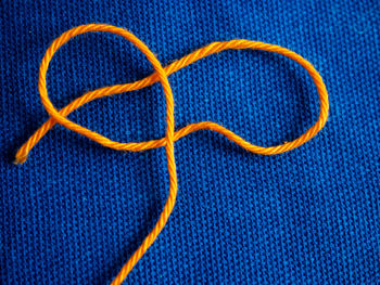 Close-up of computer keyboard against blue background