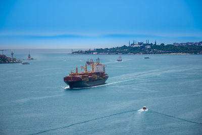 Nautical vessel on sea against sky