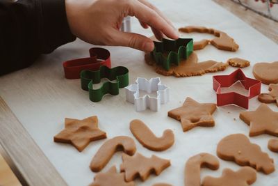 Midsection of person having cookies