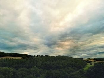 Scenic view of landscape against cloudy sky