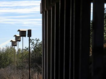 Close-up of metal fence against sky