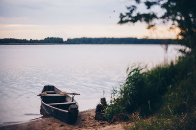 Boat in lake against sky