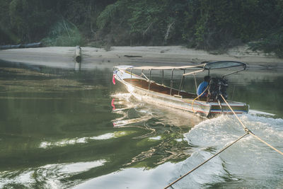 Boats moored in lake