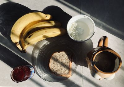 Breakfast with sunrise lighting on table, seen from above