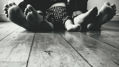 Low section of woman sitting on floor