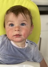 Portrait of cute baby looking slightly upwards towards the camera 