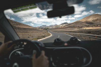 Road seen through car windshield